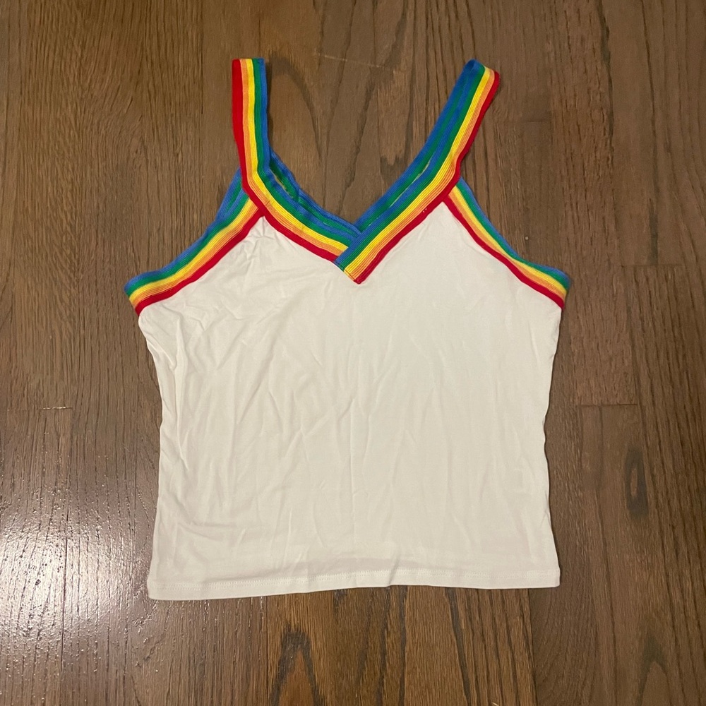 The brand is Free Agent white with rainbow ridges size small